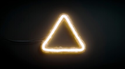 Illuminated triangle shape formed by glowing yellow neon light against a dark backdrop
