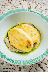 A delightful plate showcases toasted bread garnished with herbs over a creamy mushroom sauce