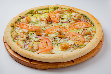 Tasty pizza with fresh tomatoes, grilled chicken, and colorful toppings