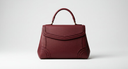 Elegant Burgundy Leather Handbag on White.