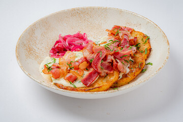 A vibrant breakfast of ripe plantains, crispy bacon, and zesty pickled onions awaits!