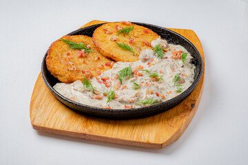 Crispy pancakes paired with creamy sauce create a mouthwatering dish that delights the senses