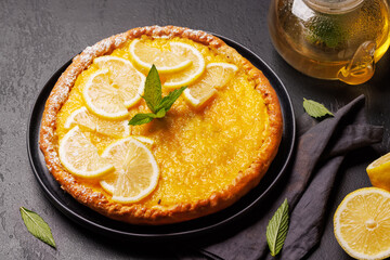 Delicious lemon tart with golden crust and smooth, glossy lemon filling