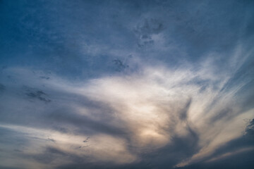 storm clouds float across the blue sky
