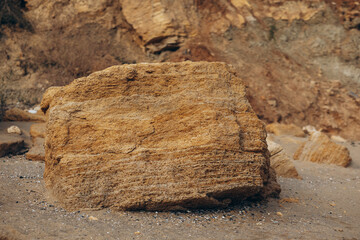 Sea waves lash line impact rock on the beach