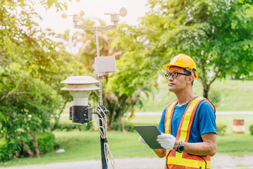 Man working collecting Air pollution, Weather monitor, Wind information data from sensor station