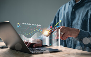 Analyzing data market performance for a business report with KPI metrics, a businessman uses a...