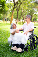 Senior, couple and people with disability in park for fresh air, walking and enjoyment of...