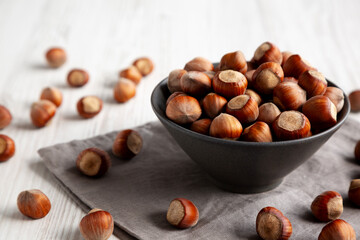 Organic Raw Hazelnuts in a Bowl, side view. Close-up.