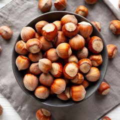 Organic Raw Hazelnuts in a Bowl, top view. Close-up.