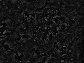 Naklejka premium A monochromatic black and gray abstract background with a rough, gritty, and uneven stone-like texture.