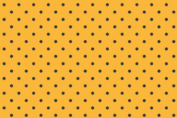 ハロウィンに最適な黄色と黒の水玉背景

