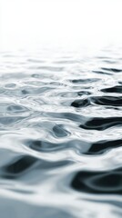 Abstract close-up of dark water surface with soft ripples and gentle light reflections ideal for backgrounds, spa visuals and calm nature-inspired designs
