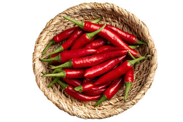 Fresh red chili peppers in woven basket isolated on transparent background