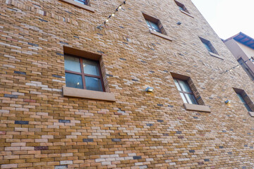 Modern Condominium and apartment building red brick wall in the city downtown,Residential Building on sky background.	