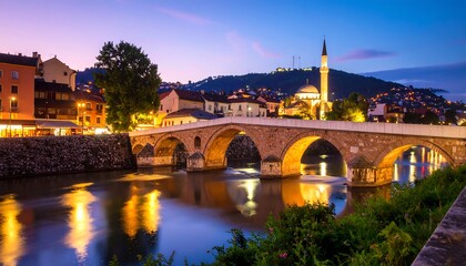 Obraz premium Evening cityscape of a historic bridge