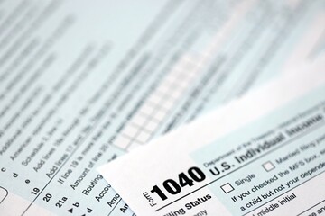 1040 US individual income tax return form blank close up. Few pages of united states tax blank