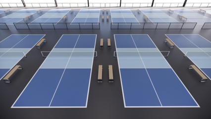 Back side pickleball tennis courts inside large metal structure building