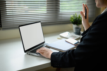 Close-up image of Online video call concept showing a professional greeting through laptop display...