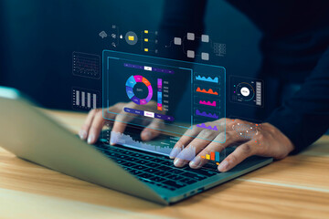 Business analysts use computers and dashboards to analyze data and metrics connected to databases...