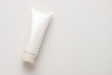Top Table View of White Cosmetic Tube on a Minimalist Background