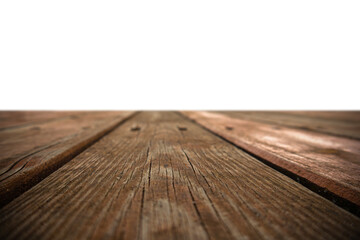 Wood planks arranged in a linear pattern on a surface during daylight