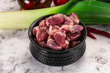 Raw chicken hearts in the bowl