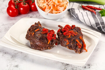 Baked beef cheeks with vegetables