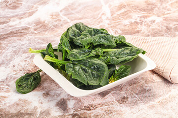 Fresh green spinach leaves heap