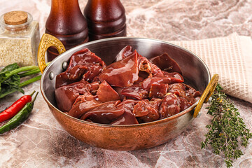 Raw uncokked chicken liver in the bowl