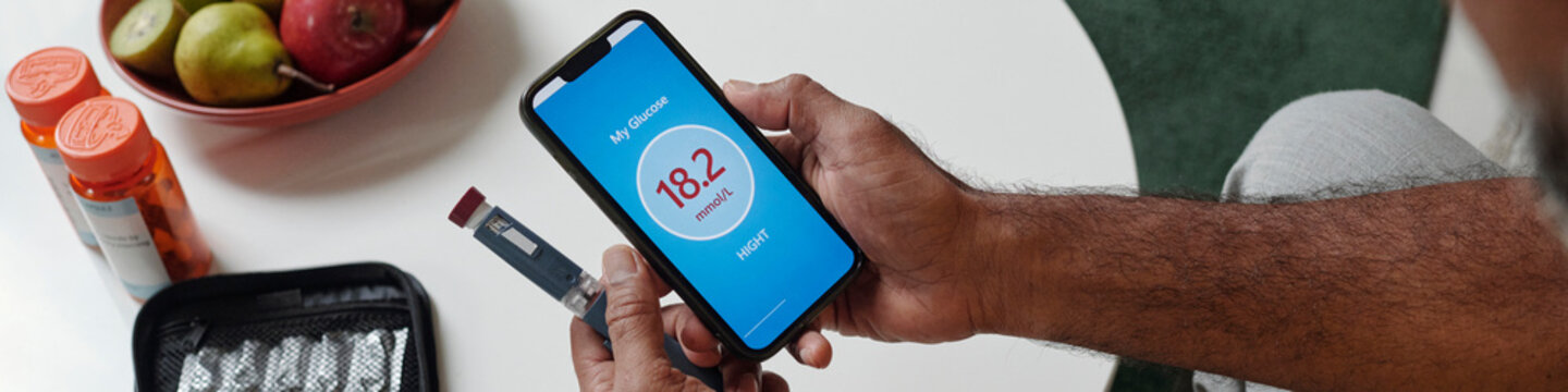 Person using smartphone app to monitor diabetes glucose level risk