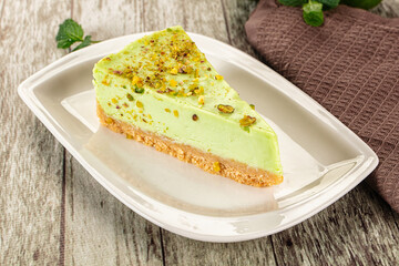 Green pistachio cheesecake served mint