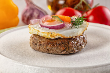 Beefsteak chop with roasted egg