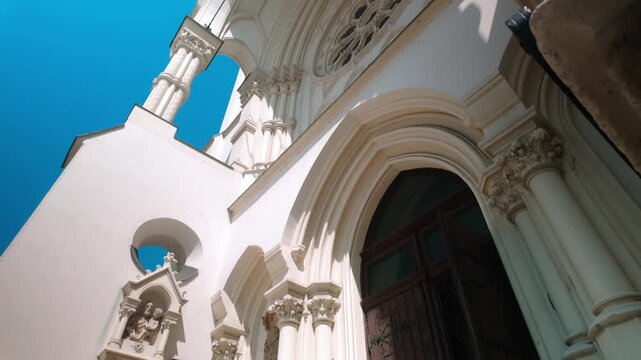 Stone step lead to Arched entrance of Neo Gothic Catholic Church LOW ANGLE