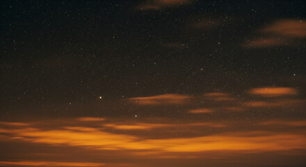Fototapeta premium Starry night sky with orange clouds