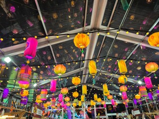 Colorful Hanging Lanterns and String Lights Indoors