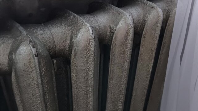 There's a gray old battery in the room. An old radiator in the house. Heating season .Rising prices.