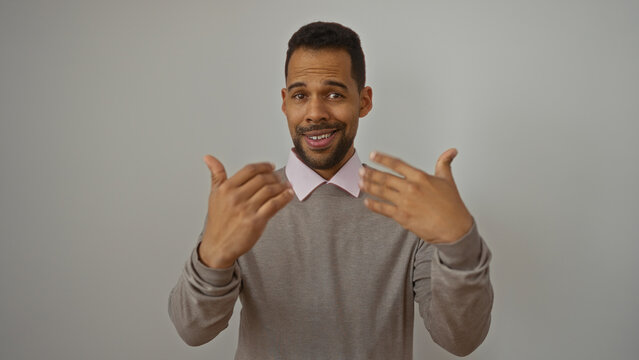 Young hispanic man gesturing come here with hands over white background looking confident and welcoming