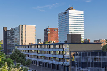 A modern urban skyline featuring a prominent white high-rise, various apartment blocks, and lower buildings, Kanaleneiland Utrecht, Netherlands. 17 July 2025.