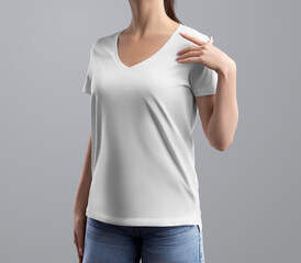 Mockup of a white t-shirt with a v-neck, on a posing girl close-up, front, for design, branding.