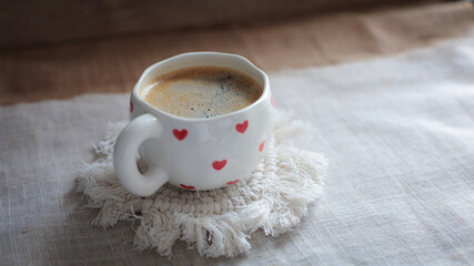 cup of coffee on a simple background, cozy home, notebook and coffee, coffee beans, flatlay, background