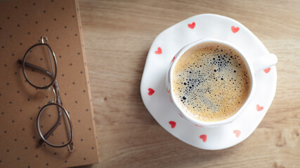 cup of coffee on a simple background, cozy home, notebook and coffee, coffee beans, flatlay, background