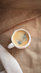 cup of coffee on a simple background, cozy home, notebook and coffee, coffee beans, flatlay, background