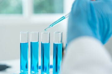 Scientist analyze biochemical samples in advanced scientific laboratory. Medical professional use...