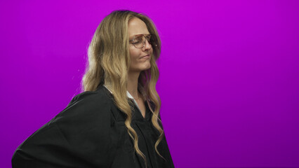 Woman with back pain judge wearing young blonde uniform isolated on purple background.