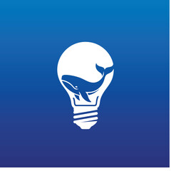 Negative Space logo of a whale swimming inside a lightbulb. This black and white vector icon represents big ideas, deep thinking, marine conservation, and creative energy.