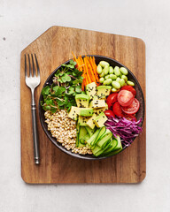 Buddha bowl with green buckwheat and vegetables, healthy food, top view