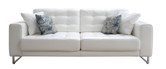 White leather sofa with tufted back and light blue patterned pillows