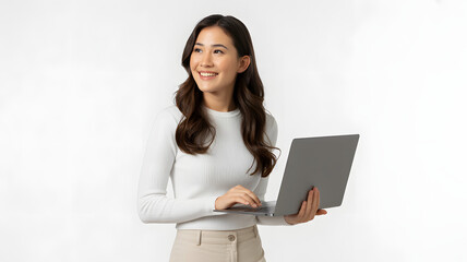 Smiling woman in white sweater holding a laptop and looking off to the side on a white background