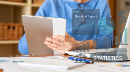 Businesswoman using digital tablet analyzing financial report, growth charts, statistics, and key performance indicators (kpi) for business strategy and planning